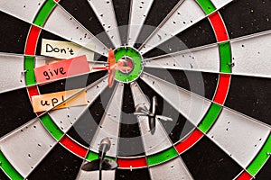 Stickers with the inscription dont give up on the game of darts. concept road to success