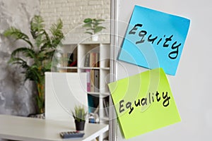 Stickers with words Equity and equality in the workplace.