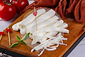 sticks made of buffalo mozzarella and red tomatoes