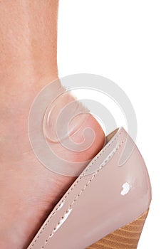 Sticky bandage on woman heel