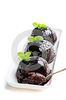 Sticky chocolate puddings isolated on white