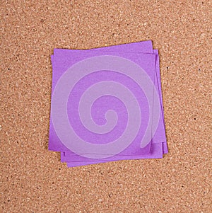 Sticky note on a bulletin board