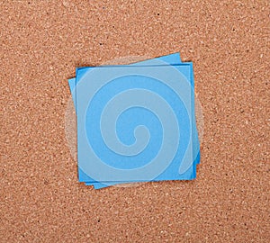 Sticky note on a bulletin board