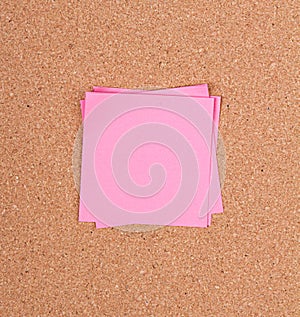 Sticky note on a bulletin board