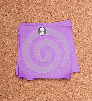 Sticky note on a bulletin board