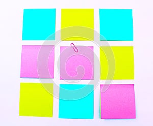 Yellow, pink, blue sticky note isolate on white background