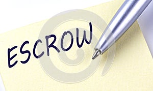 Sticky Note Message ESCROW with pen on white background