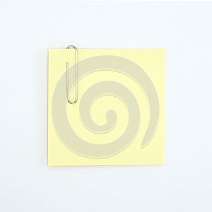 Sticky note and paperclip