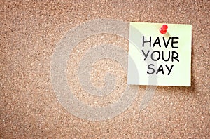 Sticky note with the phrase have your say. room for text. photo