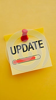 Yellow sticky note with UPDATE text and red progress bar, symbolizing progress