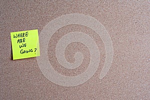 Sticky Note with Where Are We Going on a Corkboard