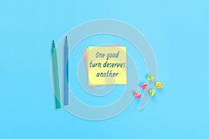 Sticky notes with handwritten text One good turn deserves another
