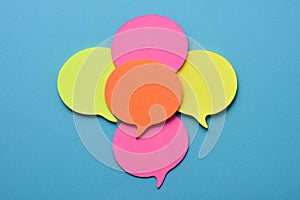 Sticky notes in the shape of speech balloons