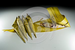 Sticky rice in bamboo grass leaf, shape look like buffalo head which is known as Kao Tom Kao Kway.