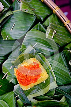 Sticky rice wrapped in banana leaf