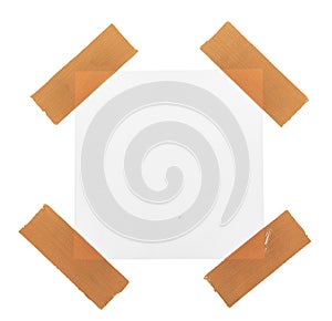 Sticky tape on note paper isolated