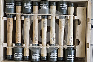 World War II fragmentation grenades stacked in a military box. Gun shop