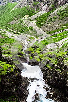 Stigfossen waterfall near Trollstigen or Troll Stairs, a serpentine mountain road that is popular tourist attraction