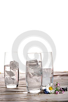 Stil mineral drink water in glass bottle served with three glass