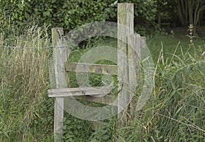 Stile in the countryside crossing into a field