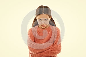 Still angry. Disagreement and stubbornness. Girl serious face offended white background. Kid little girl unhappy looks photo