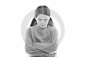 Still angry. Disagreement and stubbornness. Girl serious face offended white background. Kid little girl unhappy looks photo