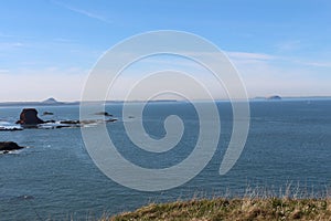 Still and calm seascape scene in sunny Scotland