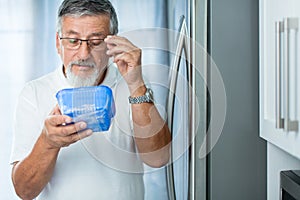 Is this still fine? Senior man in his kitchen by the fridge