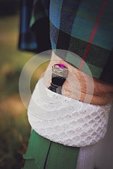 Man wearing a sgian dubh - part of a traditional highland wear outfit at wedding