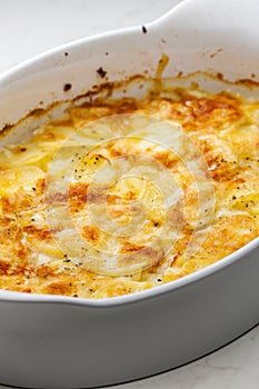 still ife of baked potatoes with cheese
