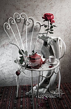 Still life with antique chair, rose and tea