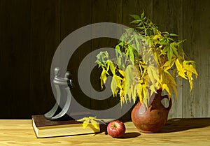 Still life with apples and ceramic vases on the table