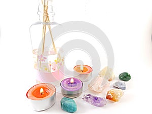 Still life of aromatic candles and precious stones. photo