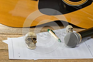 Still life art photography concept with skull and guitar