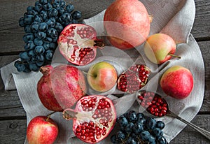 Still life of autumn fruits, pomegranates, apples. Vintage.