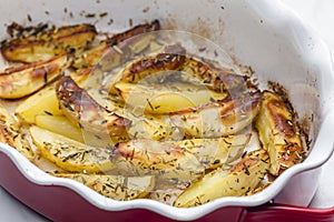 still life of baked potatoes with herbs