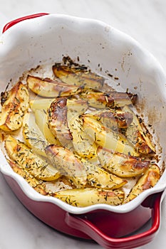 still life of baked potatoes with herbs