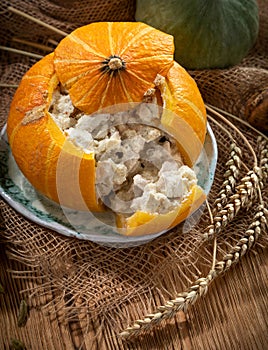 Still life with baked stuffed pumpkin