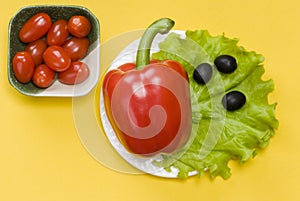 Still life of bell pepper, tomato cherry, lettuce and olives