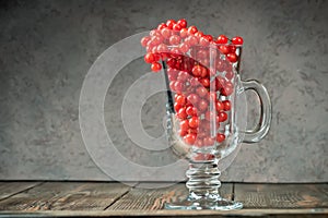 Still life berries of a viburnum in a glass