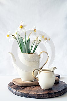 Still life with a blooming bouquet of white daffodils