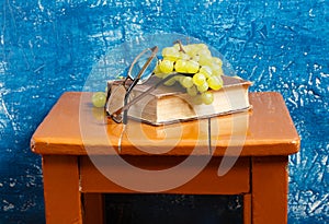 Still life with book and grapes