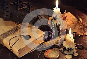 Still life with books, candles and magic objects