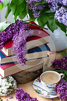 Still life books, coffee and lilacs.