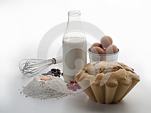 Still life with a bottle of milk, flour, eggs and an artisan cake 2