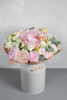 Still life with a bouquet of flowers. the florist put together a beautiful bunch of flowers. Man manual work used photo