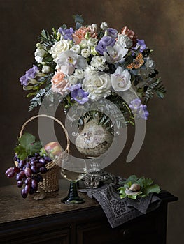 Still life with bouquet of flowers and fruit vase