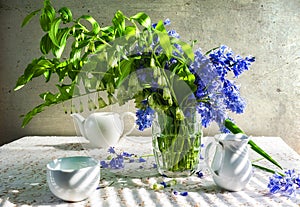 Still life bouquet polygonatum blue tones white crockery