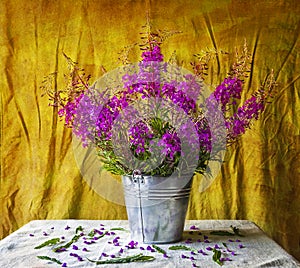 Still life with bouquet purple wild flowers