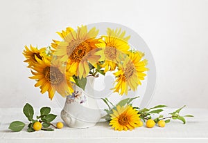 Still life with bouquet of sunflowers, and cherry plums